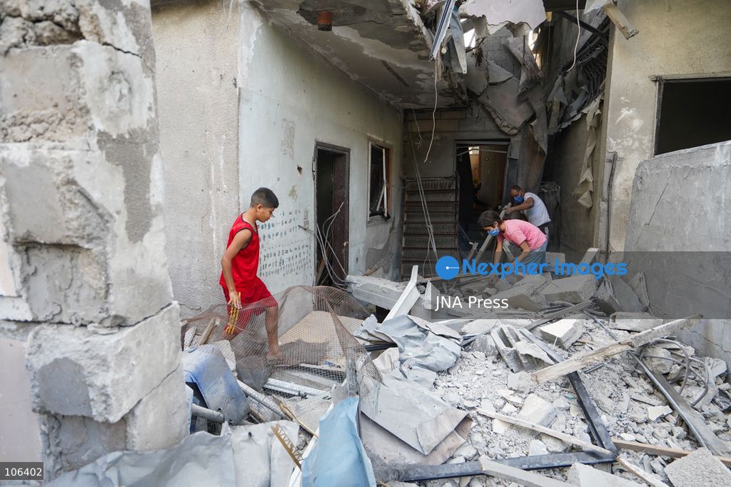 MAGHAZI REFUGEE CAMP, GAZA STRIP, PALESTINE, [MONTH DAY, YEAR]: Destruction following Israeli airstrikes that hit homes belonging to the Saada and Abu Muaileq families in Maghazi refugee camp in the central Gaza Strip. The strikes on October 15 destroyed both homes and caused extensive damage to surrounding residential buildings. Photo by Ramzi Abu AMER/ JNA Press. (Photo by Ramzi Abu Amer/JNA Press via Nexpher Images)