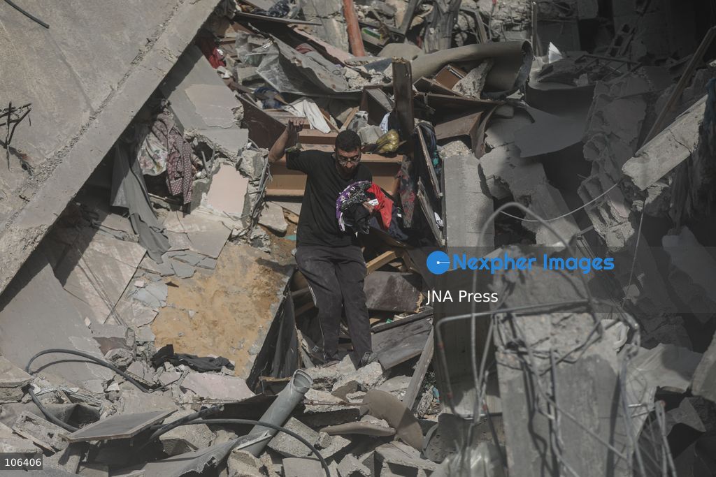 MAGHAZI REFUGEE CAMP, GAZA STRIP, PALESTINE, [MONTH DAY, YEAR]: Destruction following Israeli airstrikes that hit homes belonging to the Saada and Abu Muaileq families in Maghazi refugee camp in the central Gaza Strip. The strikes on October 15 destroyed both homes and caused extensive damage to surrounding residential buildings. Photo by Ramzi Abu AMER/ JNA Press. (Photo by Ramzi Abu Amer/JNA Press via Nexpher Images)