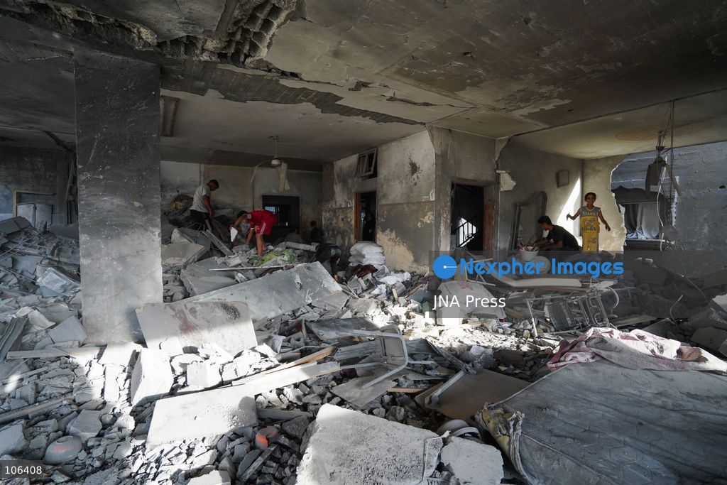 MAGHAZI REFUGEE CAMP, GAZA STRIP, PALESTINE, [MONTH DAY, YEAR]: Destruction following Israeli airstrikes that hit homes belonging to the Saada and Abu Muaileq families in Maghazi refugee camp in the central Gaza Strip. The strikes on October 15 destroyed both homes and caused extensive damage to surrounding residential buildings. Photo by Ramzi Abu AMER/ JNA Press. (Photo by Ramzi Abu Amer/JNA Press via Nexpher Images)