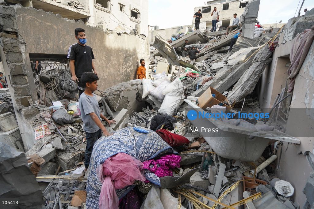 MAGHAZI REFUGEE CAMP, GAZA STRIP, PALESTINE, [MONTH DAY, YEAR]: Destruction following Israeli airstrikes that hit homes belonging to the Saada and Abu Muaileq families in Maghazi refugee camp in the central Gaza Strip. The strikes on October 15 destroyed both homes and caused extensive damage to surrounding residential buildings. Photo by Ramzi Abu AMER/ JNA Press. (Photo by Ramzi Abu Amer/JNA Press via Nexpher Images)