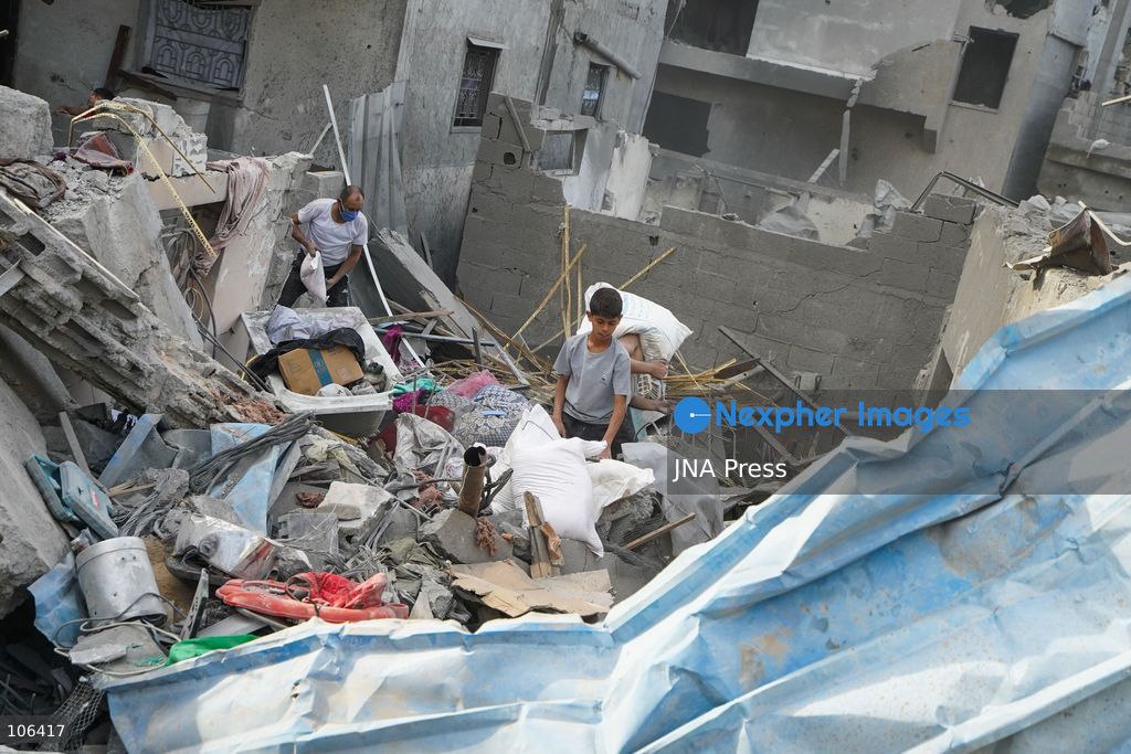 MAGHAZI REFUGEE CAMP, GAZA STRIP, PALESTINE, [MONTH DAY, YEAR]: Destruction following Israeli airstrikes that hit homes belonging to the Saada and Abu Muaileq families in Maghazi refugee camp in the central Gaza Strip. The strikes on October 15 destroyed both homes and caused extensive damage to surrounding residential buildings. Photo by Ramzi Abu AMER/ JNA Press. (Photo by Ramzi Abu Amer/JNA Press via Nexpher Images)