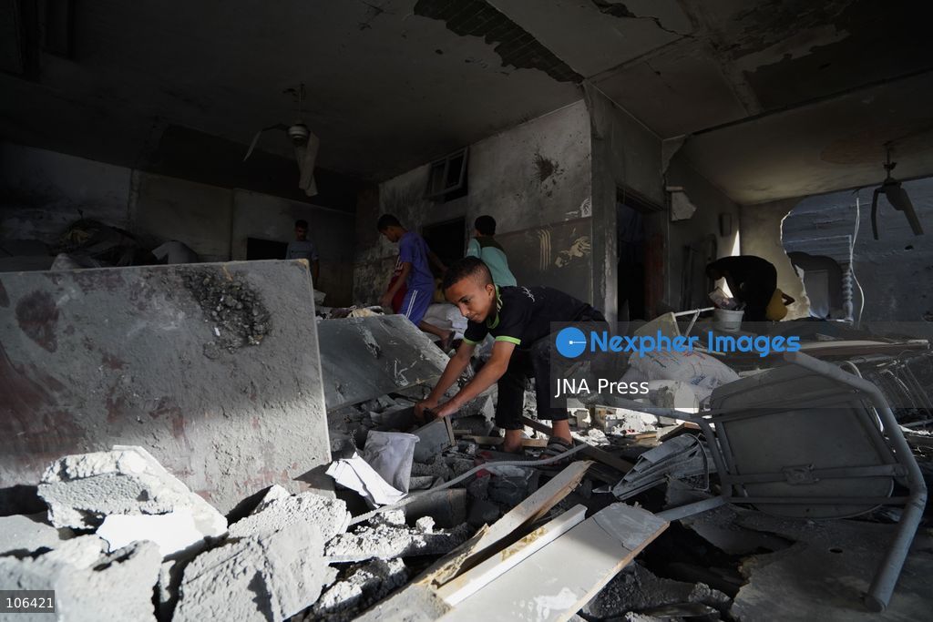 MAGHAZI REFUGEE CAMP, GAZA STRIP, PALESTINE, [MONTH DAY, YEAR]: Destruction following Israeli airstrikes that hit homes belonging to the Saada and Abu Muaileq families in Maghazi refugee camp in the central Gaza Strip. The strikes on October 15 destroyed both homes and caused extensive damage to surrounding residential buildings. Photo by Ramzi Abu AMER/ JNA Press. (Photo by Ramzi Abu Amer/JNA Press via Nexpher Images)