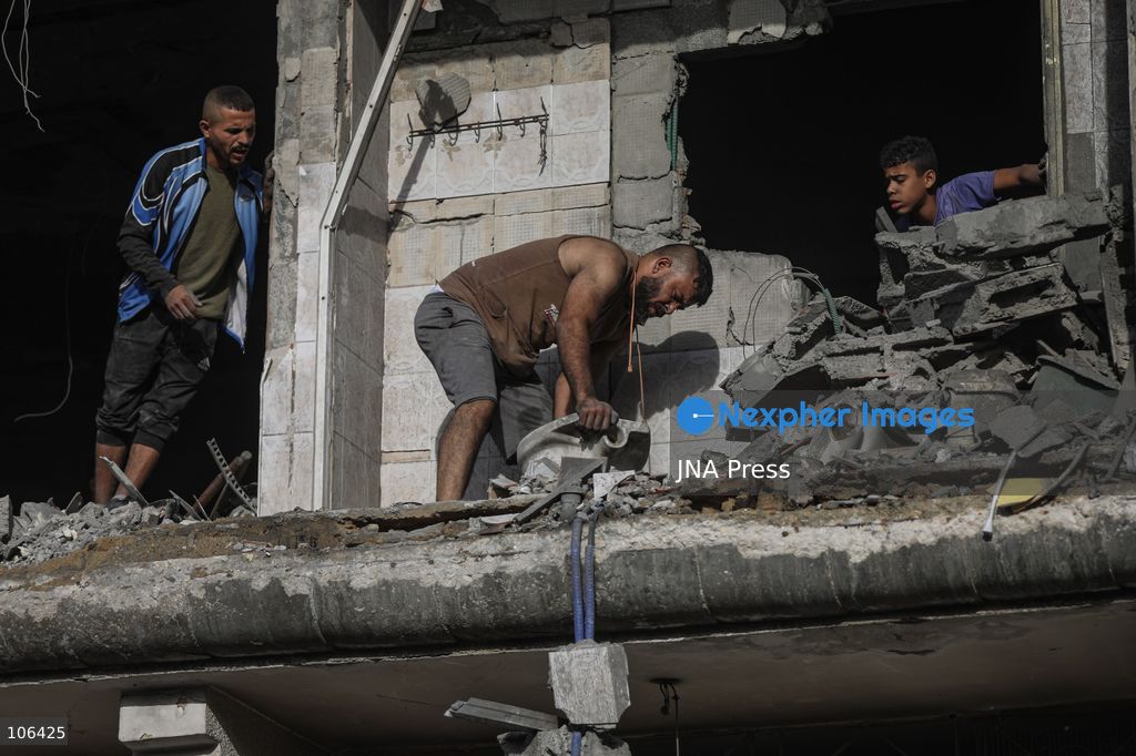 MAGHAZI REFUGEE CAMP, GAZA STRIP, PALESTINE, [MONTH DAY, YEAR]: Destruction following Israeli airstrikes that hit homes belonging to the Saada and Abu Muaileq families in Maghazi refugee camp in the central Gaza Strip. The strikes on October 15 destroyed both homes and caused extensive damage to surrounding residential buildings. Photo by Ramzi Abu AMER/ JNA Press. (Photo by Ramzi Abu Amer/JNA Press via Nexpher Images)