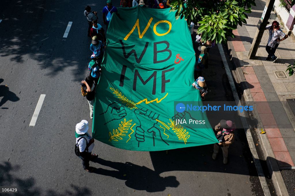 BANGKOK, THAILAND, OCTOBER 16, 2026: Members of Thailand’s Assembly of the Poor and allied community networks demonstrate during the annual meetings of the International Monetary Fund (IMF) and the World Bank Group. Protesters march towards the Queen Sirikit National Convention Center, calling for debt relief, greater public oversight of government borrowing and more public participation in economic policymaking. Photo by Captain Jirathummanuwat / JNA Press. (Photo by Captain Jirathummanuwat/JNA Press via Nexpher Images)