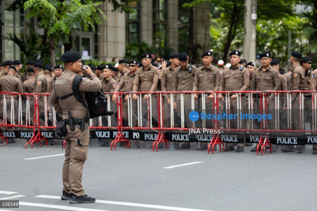 BANGKOK, THAILAND, OCTOBER 16, 2026: Police stand behind barriers near the Queen Sirikit National Convention Center during the annual meetings of the International Monetary Fund (IMF) and the World Bank Group. Authorities deploy crowd-control officers and restrict road access as members of the Assembly of the Poor and allied networks march towards the venue to demand economic justice. Photo by Thanatchanont Jiraworathanakul / JNA Press. (Photo by Thanatchanont Jiraworathanakul/JNA Press via Nexpher Images)