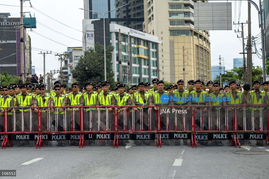 BANGKOK, THAILAND, OCTOBER 16, 2026: Police stand behind barriers near the Queen Sirikit National Convention Center during the annual meetings of the International Monetary Fund (IMF) and the World Bank Group. Authorities deploy crowd-control officers and restrict road access as members of the Assembly of the Poor and allied networks march towards the venue to demand economic justice. Photo by Thanatchanont Jiraworathanakul / JNA Press. (Photo by Thanatchanont Jiraworathanakul/JNA Press via Nexpher Images)