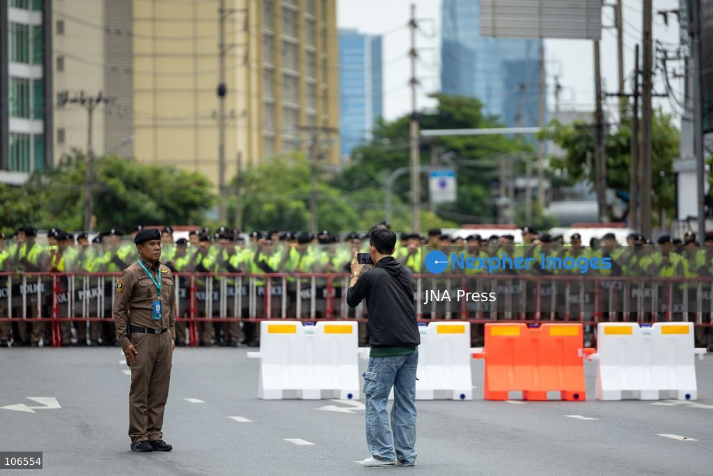 BANGKOK, THAILAND, OCTOBER 16, 2026: Police stand behind barriers near the Queen Sirikit National Convention Center during the annual meetings of the International Monetary Fund (IMF) and the World Bank Group. Authorities deploy crowd-control officers and restrict road access as members of the Assembly of the Poor and allied networks march towards the venue to demand economic justice. Photo by Thanatchanont Jiraworathanakul / JNA Press. (Photo by Thanatchanont Jiraworathanakul/JNA Press via Nexpher Images)