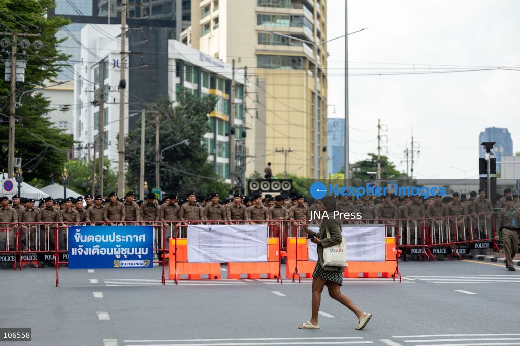 BANGKOK, THAILAND, OCTOBER 16, 2026: Police stand behind barriers near the Queen Sirikit National Convention Center during the annual meetings of the International Monetary Fund (IMF) and the World Bank Group. Authorities deploy crowd-control officers and restrict road access as members of the Assembly of the Poor and allied networks march towards the venue to demand economic justice. Photo by Thanatchanont Jiraworathanakul / JNA Press. (Photo by Thanatchanont Jiraworathanakul/JNA Press via Nexpher Images)