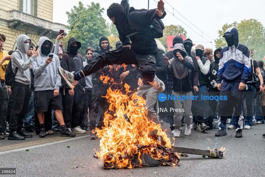 TURIN, ITALY, OCTOBER 16, 2026: Students demonstrate for improved school conditions and greater education funding following a wave of school occupations. Clashes erupt in Piazza Castello, where some demonstrators throw stones and police use water cannons, tear gas and baton charges. Teachers form human chains between students and officers during confrontations. The march ends at Palazzo Nuovo, part of the University of Turin. Photo by Camilla Baronetto / JNA Press. (Photo by Camilla Baronetto/JNA Press via Nexpher Images)