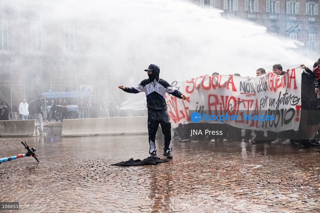 TURIN, ITALY, OCTOBER 16, 2026: Students demonstrate for improved school conditions and greater education funding following a wave of school occupations. Clashes erupt in Piazza Castello, where some demonstrators throw stones and police use water cannons, tear gas and baton charges. Teachers form human chains between students and officers during confrontations. The march ends at Palazzo Nuovo, part of the University of Turin. Photo by Camilla Baronetto / JNA Press. (Photo by Camilla Baronetto/JNA Press via Nexpher Images)