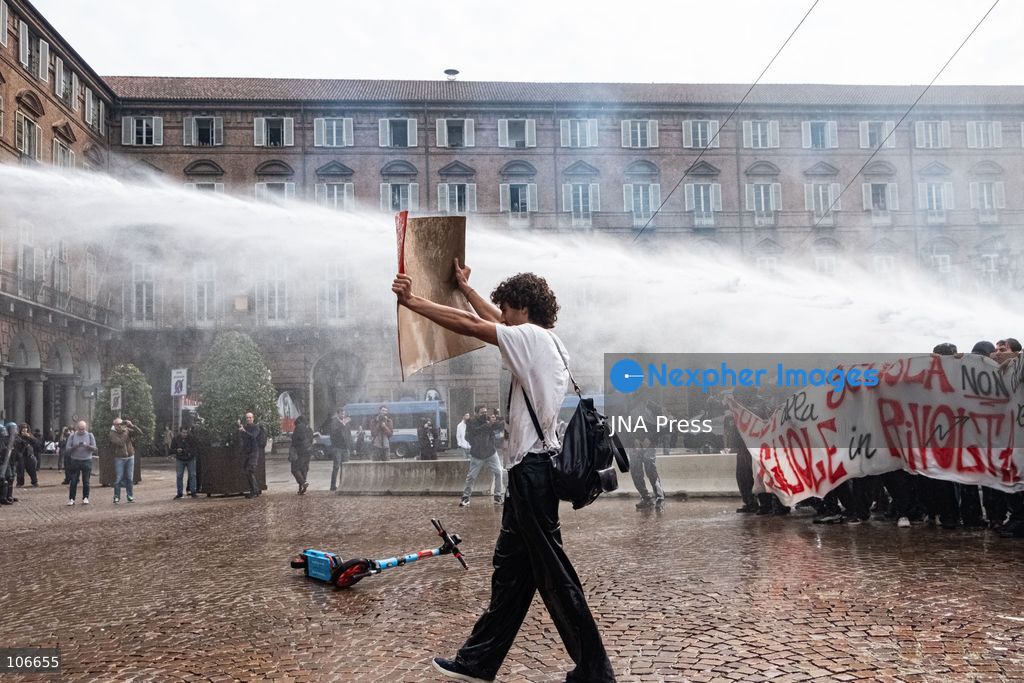 TURIN, ITALY, OCTOBER 16, 2026: Students demonstrate for improved school conditions and greater education funding following a wave of school occupations. Clashes erupt in Piazza Castello, where some demonstrators throw stones and police use water cannons, tear gas and baton charges. Teachers form human chains between students and officers during confrontations. The march ends at Palazzo Nuovo, part of the University of Turin. Photo by Camilla Baronetto / JNA Press. (Photo by Camilla Baronetto/JNA Press via Nexpher Images)