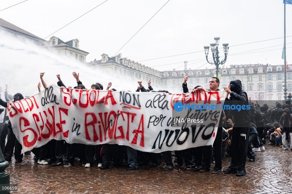 TURIN, ITALY, OCTOBER 16, 2026: Students demonstrate for improved school conditions and greater education funding following a wave of school occupations. Clashes erupt in Piazza Castello, where some demonstrators throw stones and police use water cannons, tear gas and baton charges. Teachers form human chains between students and officers during confrontations. The march ends at Palazzo Nuovo, part of the University of Turin. Photo by Camilla Baronetto / JNA Press. (Photo by Camilla Baronetto/JNA Press via Nexpher Images)