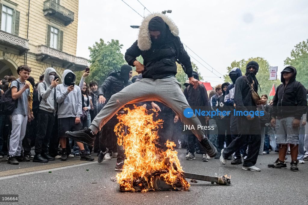 TURIN, ITALY, OCTOBER 16, 2026: Students demonstrate for improved school conditions and greater education funding following a wave of school occupations. Clashes erupt in Piazza Castello, where some demonstrators throw stones and police use water cannons, tear gas and baton charges. Teachers form human chains between students and officers during confrontations. The march ends at Palazzo Nuovo, part of the University of Turin. Photo by Camilla Baronetto / JNA Press. (Photo by Camilla Baronetto/JNA Press via Nexpher Images)