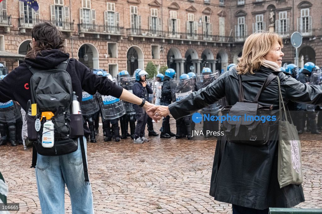 TURIN, ITALY, OCTOBER 16, 2026: Students demonstrate for improved school conditions and greater education funding following a wave of school occupations. Clashes erupt in Piazza Castello, where some demonstrators throw stones and police use water cannons, tear gas and baton charges. Teachers form human chains between students and officers during confrontations. The march ends at Palazzo Nuovo, part of the University of Turin. Photo by Camilla Baronetto / JNA Press. (Photo by Camilla Baronetto/JNA Press via Nexpher Images)