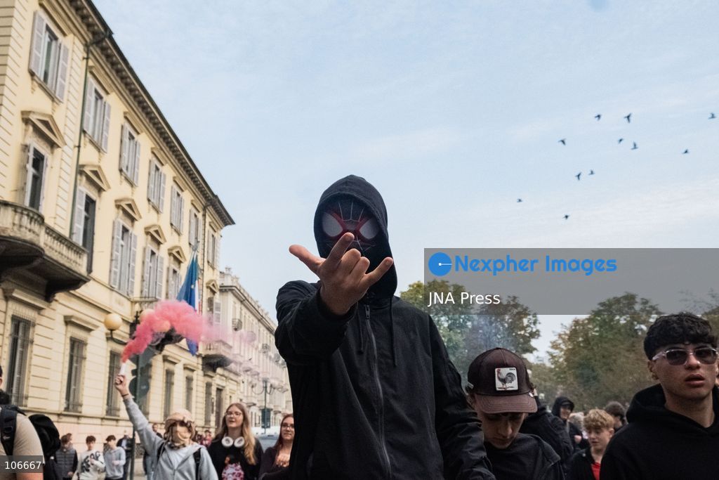 TURIN, ITALY, OCTOBER 16, 2026: Students demonstrate for improved school conditions and greater education funding following a wave of school occupations. Clashes erupt in Piazza Castello, where some demonstrators throw stones and police use water cannons, tear gas and baton charges. Teachers form human chains between students and officers during confrontations. The march ends at Palazzo Nuovo, part of the University of Turin. Photo by Camilla Baronetto / JNA Press. (Photo by Camilla Baronetto/JNA Press via Nexpher Images)