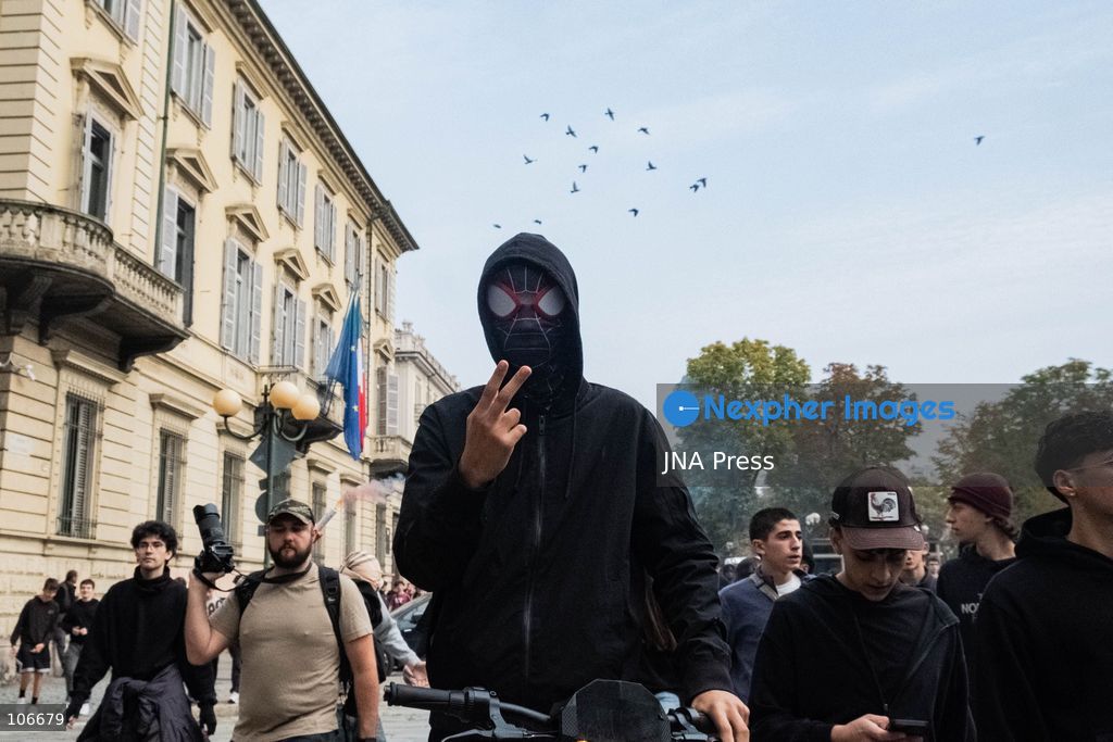 TURIN, ITALY, OCTOBER 16, 2026: Students demonstrate for improved school conditions and greater education funding following a wave of school occupations. Clashes erupt in Piazza Castello, where some demonstrators throw stones and police use water cannons, tear gas and baton charges. Teachers form human chains between students and officers during confrontations. The march ends at Palazzo Nuovo, part of the University of Turin. Photo by Camilla Baronetto / JNA Press. (Photo by Camilla Baronetto/JNA Press via Nexpher Images)