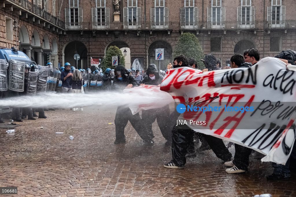 TURIN, ITALY, OCTOBER 16, 2026: Students demonstrate for improved school conditions and greater education funding following a wave of school occupations. Clashes erupt in Piazza Castello, where some demonstrators throw stones and police use water cannons, tear gas and baton charges. Teachers form human chains between students and officers during confrontations. The march ends at Palazzo Nuovo, part of the University of Turin. Photo by Camilla Baronetto / JNA Press. (Photo by Camilla Baronetto/JNA Press via Nexpher Images)