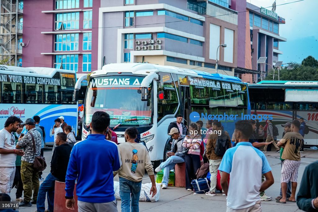 Kathmandu, NEPAL, October 16, 2026: Passengers crowd a bus terminal as they prepare to return to their hometowns and villages for the Dashain festival in Kathmandu, Nepal. Thousands of people leave the capital to celebrate the festival with their families, receive blessings from elders, and participate in traditional rituals. Dashain is one of Nepal’s biggest and most widely celebrated festivals. (Photo by ap tolang/Nexpher Images)