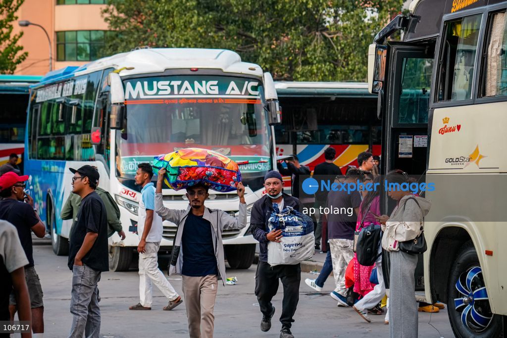 Kathmandu, NEPAL, October 16, 2026: Passengers crowd a bus terminal as they prepare to return to their hometowns and villages for the Dashain festival in Kathmandu, Nepal. Thousands of people leave the capital to celebrate the festival with their families, receive blessings from elders, and participate in traditional rituals. Dashain is one of Nepal’s biggest and most widely celebrated festivals. (Photo by ap tolang/Nexpher Images)