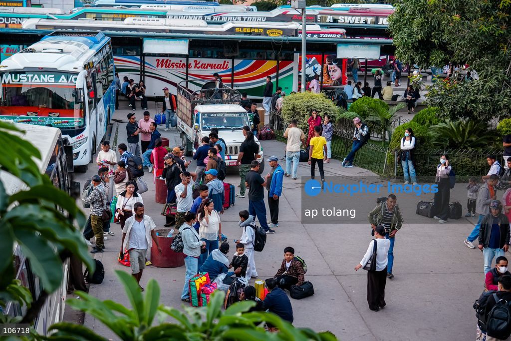 Kathmandu, NEPAL, October 16, 2026: Passengers crowd a bus terminal as they prepare to return to their hometowns and villages for the Dashain festival in Kathmandu, Nepal. Thousands of people leave the capital to celebrate the festival with their families, receive blessings from elders, and participate in traditional rituals. Dashain is one of Nepal’s biggest and most widely celebrated festivals. (Photo by ap tolang/Nexpher Images)