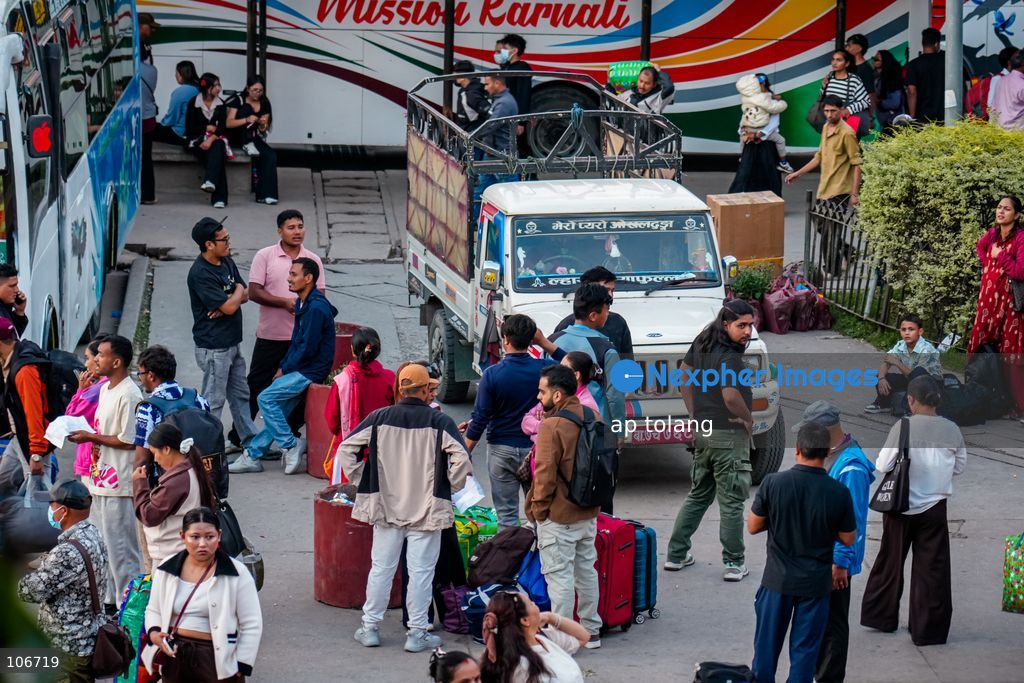 Kathmandu, NEPAL, October 16, 2026: Passengers crowd a bus terminal as they prepare to return to their hometowns and villages for the Dashain festival in Kathmandu, Nepal. Thousands of people leave the capital to celebrate the festival with their families, receive blessings from elders, and participate in traditional rituals. Dashain is one of Nepal’s biggest and most widely celebrated festivals. (Photo by ap tolang/Nexpher Images)