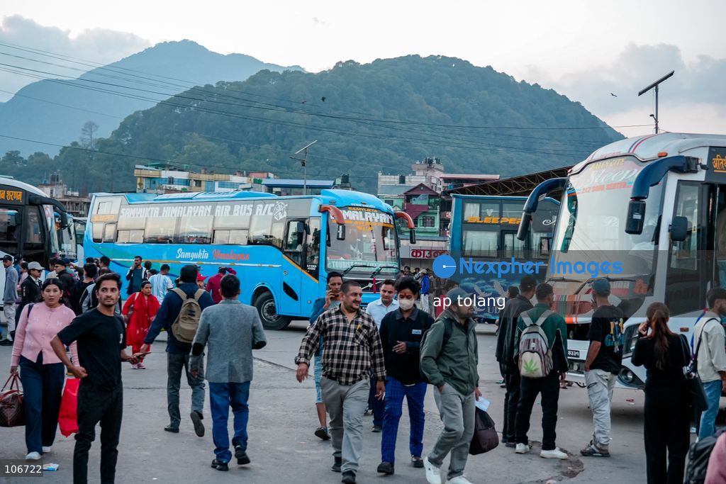 Kathmandu, NEPAL, October 16, 2026: Passengers crowd a bus terminal as they prepare to return to their hometowns and villages for the Dashain festival in Kathmandu, Nepal. Thousands of people leave the capital to celebrate the festival with their families, receive blessings from elders, and participate in traditional rituals. Dashain is one of Nepal’s biggest and most widely celebrated festivals. (Photo by ap tolang/Nexpher Images)