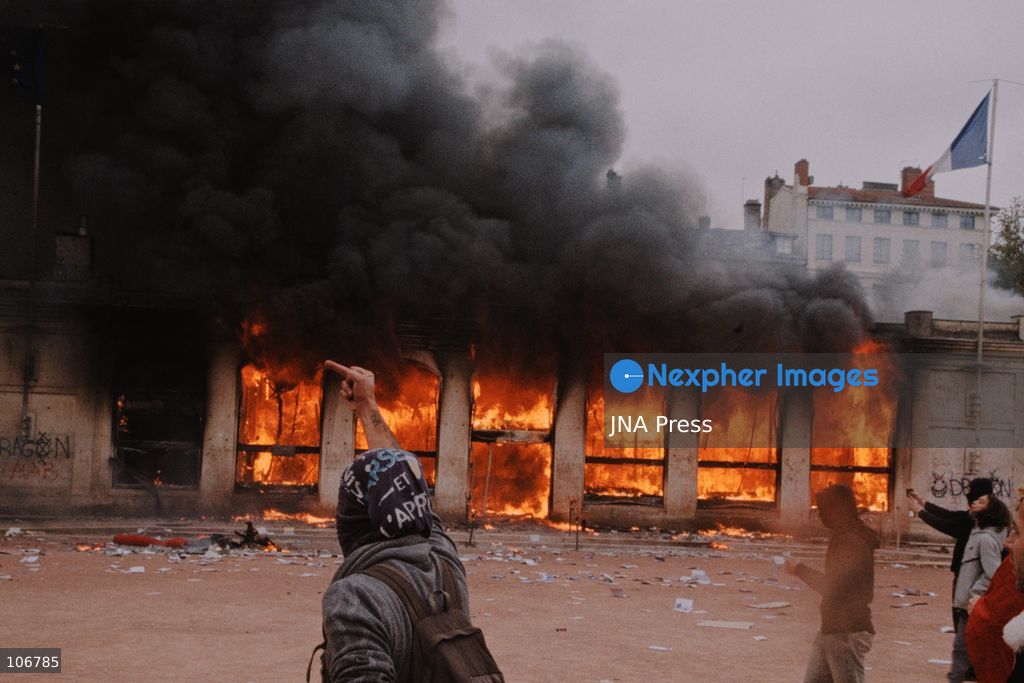 LYON, FRANCE, OCTOBER 17, 2026: Demonstrators clash with police at Place Bellecour in Lyon during nationwide protests against the high cost of living. Police use tear gas and a water cannon during the confrontations. A tourist information office on the square is ransacked and set on fire during the unrest. Photo by Julian Nelaj / JNA Press. (Photo by Julian Nelaj/JNA Press via Nexpher Images)