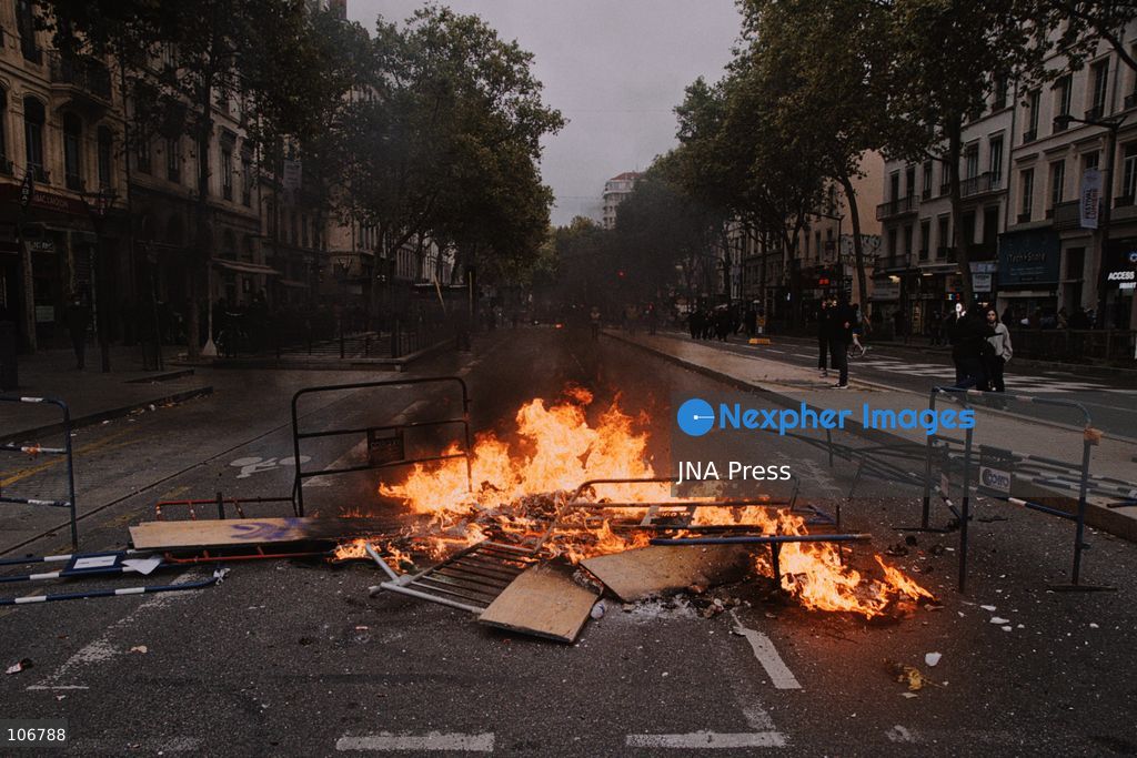 LYON, FRANCE, OCTOBER 17, 2026: Demonstrators clash with police at Place Bellecour in Lyon during nationwide protests against the high cost of living. Police use tear gas and a water cannon during the confrontations. A tourist information office on the square is ransacked and set on fire during the unrest. Photo by Julian Nelaj / JNA Press. (Photo by Julian Nelaj/JNA Press via Nexpher Images)
