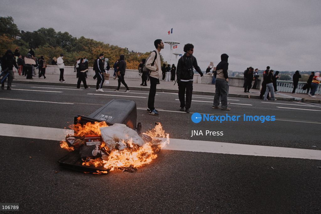 LYON, FRANCE, OCTOBER 17, 2026: Demonstrators clash with police at Place Bellecour in Lyon during nationwide protests against the high cost of living. Police use tear gas and a water cannon during the confrontations. A tourist information office on the square is ransacked and set on fire during the unrest. Photo by Julian Nelaj / JNA Press. (Photo by Julian Nelaj/JNA Press via Nexpher Images)