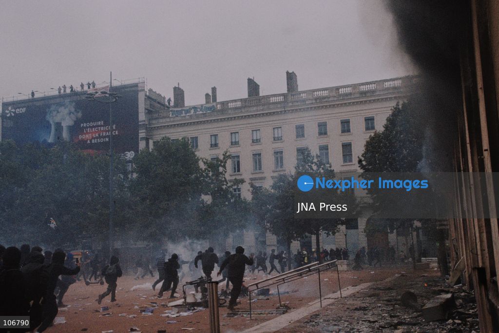 LYON, FRANCE, OCTOBER 17, 2026: Demonstrators clash with police at Place Bellecour in Lyon during nationwide protests against the high cost of living. Police use tear gas and a water cannon during the confrontations. A tourist information office on the square is ransacked and set on fire during the unrest. Photo by Julian Nelaj / JNA Press. (Photo by Julian Nelaj/JNA Press via Nexpher Images)