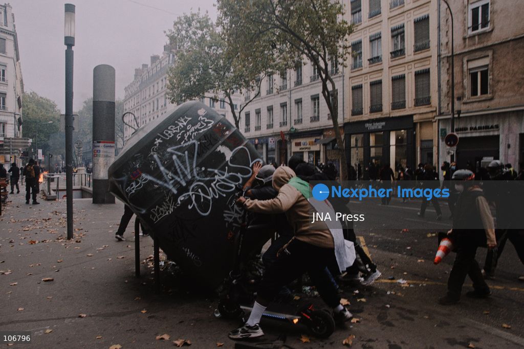 LYON, FRANCE, OCTOBER 17, 2026: Demonstrators clash with police at Place Bellecour in Lyon during nationwide protests against the high cost of living. Police use tear gas and a water cannon during the confrontations. A tourist information office on the square is ransacked and set on fire during the unrest. Photo by Julian Nelaj / JNA Press. (Photo by Julian Nelaj/JNA Press via Nexpher Images)