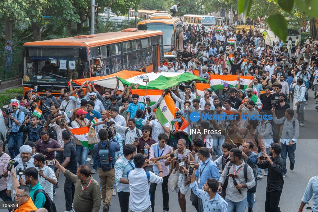 NEW DELHI, INDIA, OCTOBER 16, 2026: Protesters carry Indian national flags during the “Lehra Do Tiranga” (Wave the Tricolour) demonstration at Connaught Place in New Delhi. Called by the Cockroach Janta Party (CJP), the protest demands the resignation of Chief Election Commissioner Gyanesh Kumar over alleged irregularities linked to the Special Intensive Revision (SIR) of electoral rolls. Photo by Yanni Rawat / JNA Press. (Photo by yanni rawat/JNA Press via Nexpher Images)