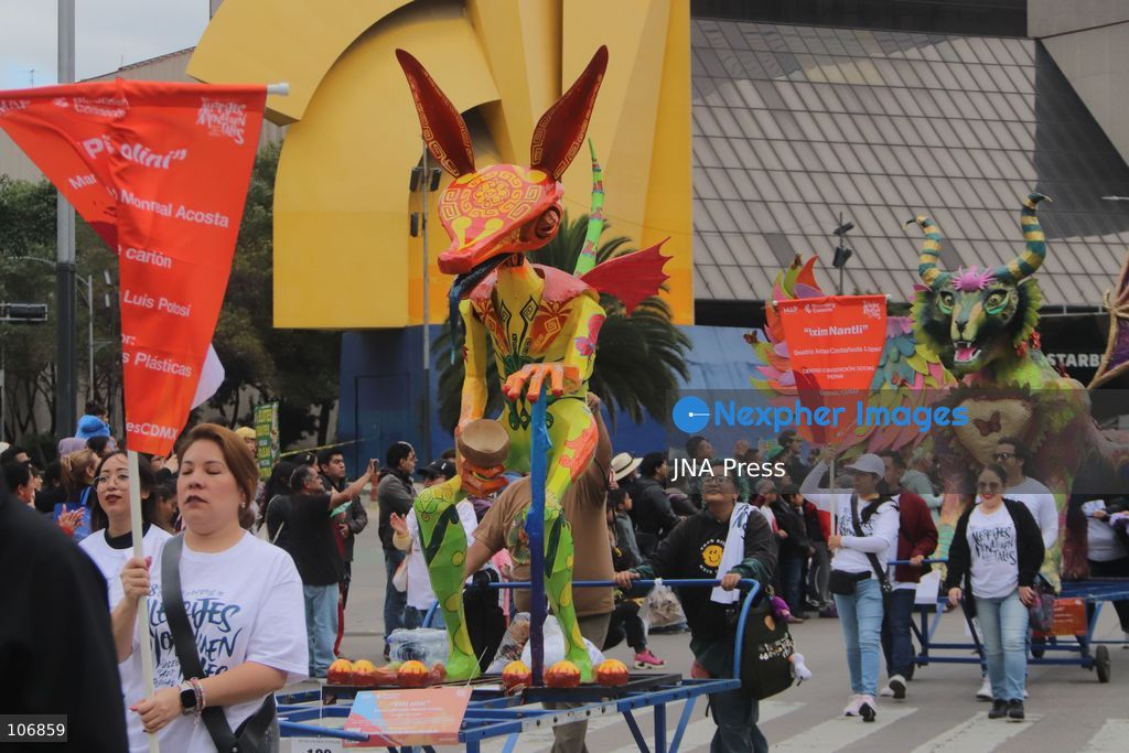 MEXICO CITY, MEXICO, OCTOBER 17, 2026: Participants accompany giant sculptures of fantastical creatures during the 18th Monumental Alebrijes Parade along Paseo de la Reforma in Mexico City. Organised by the Museo de Arte Popular (MAP), the annual event celebrates Mexican folk art and traditional craftsmanship. Photo by Carlos Santiago / JNA Press. (Photo by Carlos Santiago/JNA Press via Nexpher Images)