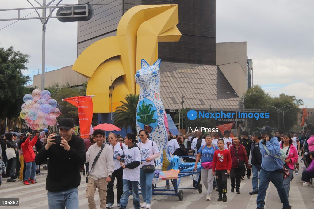 MEXICO CITY, MEXICO, OCTOBER 17, 2026: Participants accompany giant sculptures of fantastical creatures during the 18th Monumental Alebrijes Parade along Paseo de la Reforma in Mexico City. Organised by the Museo de Arte Popular (MAP), the annual event celebrates Mexican folk art and traditional craftsmanship. Photo by Carlos Santiago / JNA Press. (Photo by Carlos Santiago/JNA Press via Nexpher Images)
