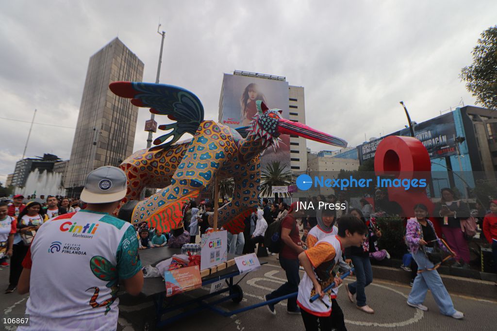 MEXICO CITY, MEXICO, OCTOBER 17, 2026: Participants accompany giant sculptures of fantastical creatures during the 18th Monumental Alebrijes Parade along Paseo de la Reforma in Mexico City. Organised by the Museo de Arte Popular (MAP), the annual event celebrates Mexican folk art and traditional craftsmanship. Photo by Carlos Santiago / JNA Press. (Photo by Carlos Santiago/JNA Press via Nexpher Images)