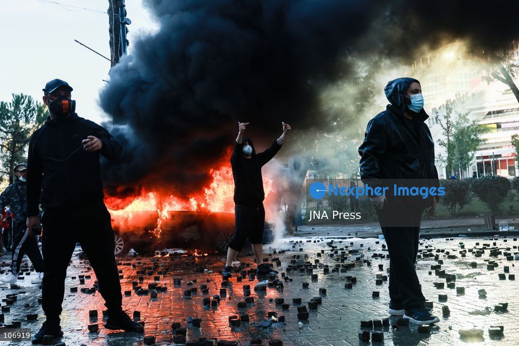 TIRANA, ALBANIA, OCTOBER 17, 2026: Demonstrators clash with riot police near the Prime Minister’s Office during student-led anti-government protests in central Tirana. Protesters throw stones and pyrotechnics, while police use tear gas, water cannons and rubber bullets. Fires break out at the High Court and the entrance to a Bank of Albania building as unrest continues for a fifth consecutive day. Demonstrators demand better university conditions and the resignation of Prime Minister Edi Rama. Photo by Vlasov Sulaj / JNA Press. (Photo by Vlasov Sulaj/JNA Press via Nexpher Images)