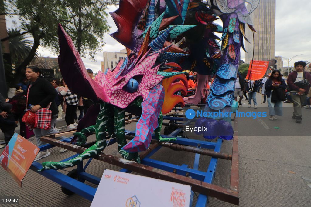 A giant, brightly colored fantastical folk-art sculpture crafted from papier-mâché, wood, and cardboard known as an "alebrije" is paraded down Paseo de la Reforma avenue during the 18th Monumental Alebrijes Parade. on October 17, 2026 in Mexico City, Mexico. (Photo by Carlos Santiago/ Eyepix Group) (Photo by Carlos Santiago/ Eyepix Group/Eyepix via Nexpher Images)