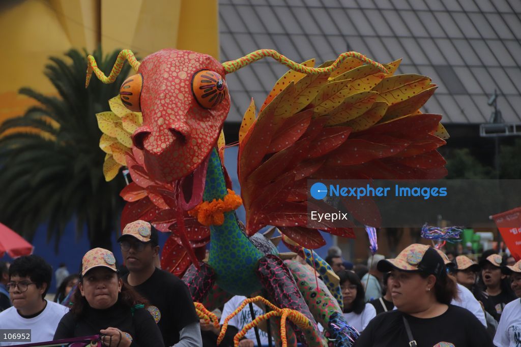 A giant, brightly colored fantastical folk-art sculpture crafted from papier-mâché, wood, and cardboard known as an "alebrije" is paraded down Paseo de la Reforma avenue during the 18th Monumental Alebrijes Parade. on October 17, 2026 in Mexico City, Mexico. (Photo by Carlos Santiago/ Eyepix Group) (Photo by Carlos Santiago/ Eyepix Group/Eyepix via Nexpher Images)