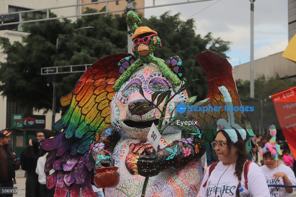 A giant, brightly colored fantastical folk-art sculpture crafted from papier-mâché, wood, and cardboard known as an "alebrije" is paraded down Paseo de la Reforma avenue during the 18th Monumental Alebrijes Parade. on October 17, 2026 in Mexico City, Mexico. (Photo by Carlos Santiago/ Eyepix Group) (Photo by Carlos Santiago/ Eyepix Group/Eyepix via Nexpher Images)