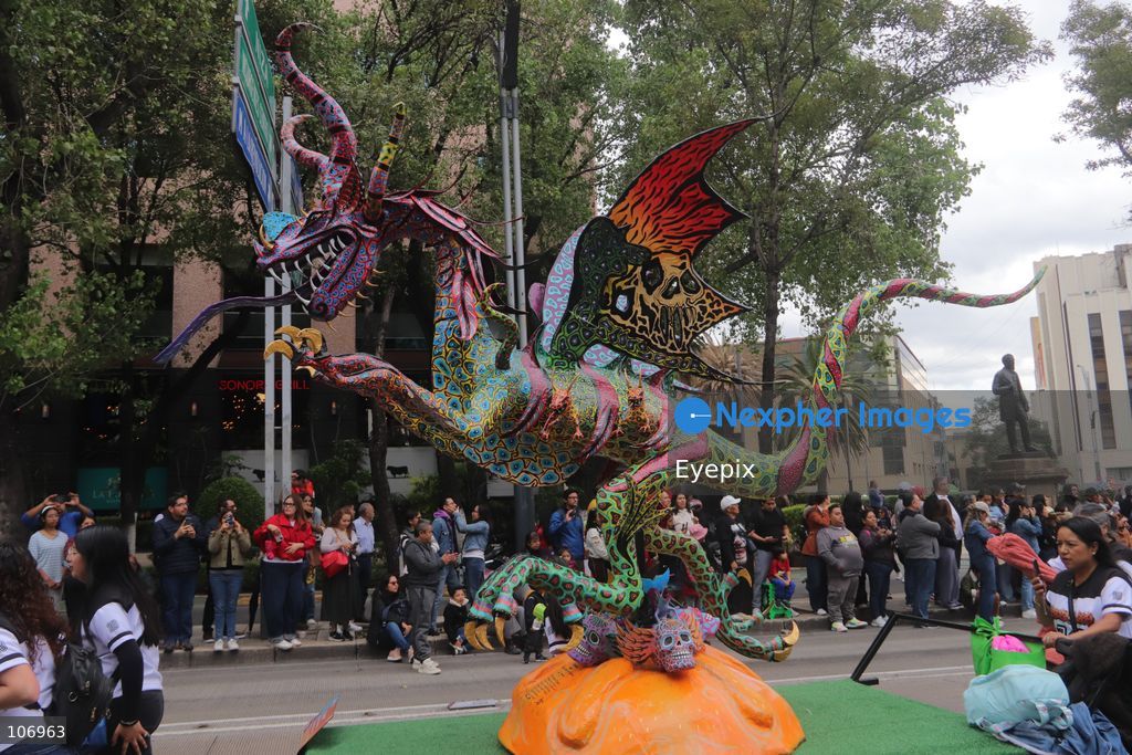A giant, brightly colored fantastical folk-art sculpture crafted from papier-mâché, wood, and cardboard known as an "alebrije" is paraded down Paseo de la Reforma avenue during the 18th Monumental Alebrijes Parade. on October 17, 2026 in Mexico City, Mexico. (Photo by Carlos Santiago/ Eyepix Group) (Photo by Carlos Santiago/ Eyepix Group/Eyepix via Nexpher Images)