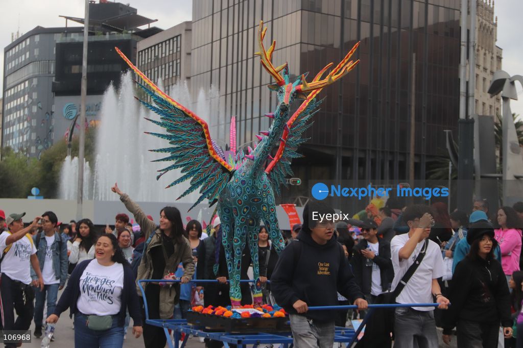 A giant, brightly colored fantastical folk-art sculpture crafted from papier-mâché, wood, and cardboard known as an "alebrije" is paraded down Paseo de la Reforma avenue during the 18th Monumental Alebrijes Parade. on October 17, 2026 in Mexico City, Mexico. (Photo by Carlos Santiago/ Eyepix Group) (Photo by Carlos Santiago/ Eyepix Group/Eyepix via Nexpher Images)