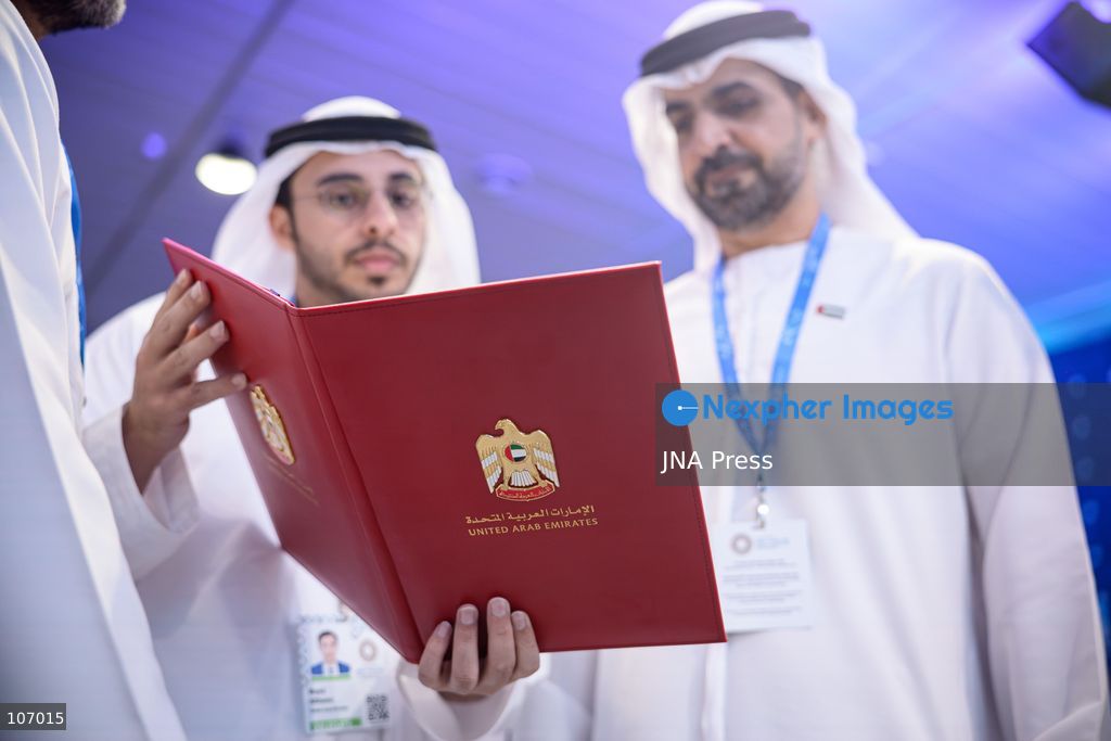 BANGKOK, THAILAND - OCTOBER 18, 2026: UAE delegates inspect a folder bearing the insignia of the United Arab Emirates and containing signing documents as Central Bank of the UAE Governor Khaled Mohamed Balama, UAE Minister of State for Financial Affairs Mohamed bin Hadi Al Hussaini, World Bank Group President Ajay Banga and International Monetary Fund (IMF) Managing Director Kristalina Georgieva take part in a signing ceremony for the UAE to host the 2029 Annual Meetings of the IMF and the World Bank Group in Abu Dhabi. (Photo by Watsawat "James" Koktabtim/JNA Press via Nexpher Images)