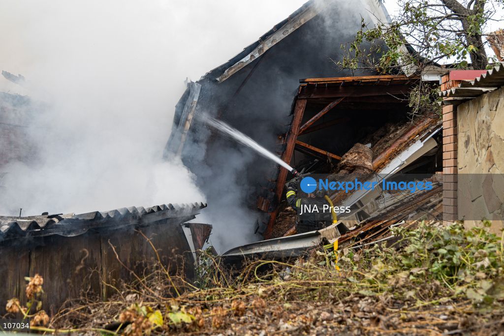 SLOVIANSK, UKRAINE, OCTOBER 17, 2026: Firefighters tackle a blaze at a residential house damaged by a Russian airstrike in Sloviansk, Donetsk region. The strike set the building’s remaining structures on fire. (Photo by Andrew Cling/JNA Press via Nexpher Images)