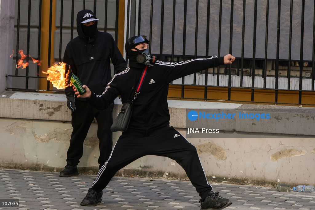 TIRANA, ALBANIA, OCTOBER 18, 2026: Demonstrators clash with riot police outside the Ministry of Education in Tirana as student-led anti-government protests continue for a sixth consecutive day. Protesters throw stones while police respond with tear gas, water cannons and rubber bullets. The demonstrations demand improved university conditions and the resignation of Prime Minister Edi Rama. (Photo by Vlasov Sulaj/JNA Press via Nexpher Images)