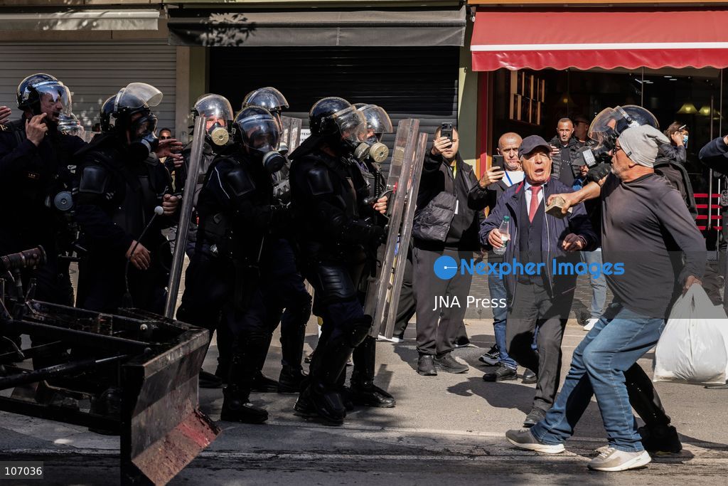 TIRANA, ALBANIA, OCTOBER 18, 2026: Demonstrators clash with riot police outside the Ministry of Education in Tirana as student-led anti-government protests continue for a sixth consecutive day. Protesters throw stones while police respond with tear gas, water cannons and rubber bullets. The demonstrations demand improved university conditions and the resignation of Prime Minister Edi Rama. (Photo by Vlasov Sulaj/JNA Press via Nexpher Images)