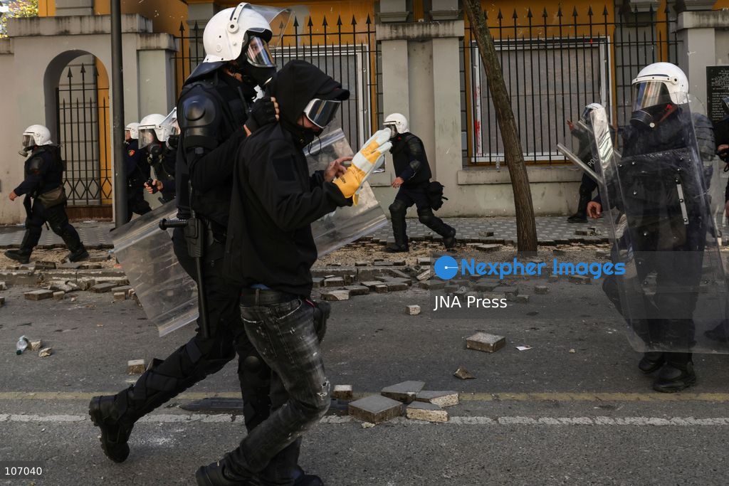TIRANA, ALBANIA, OCTOBER 18, 2026: Demonstrators clash with riot police outside the Ministry of Education in Tirana as student-led anti-government protests continue for a sixth consecutive day. Protesters throw stones while police respond with tear gas, water cannons and rubber bullets. The demonstrations demand improved university conditions and the resignation of Prime Minister Edi Rama. (Photo by Vlasov Sulaj/JNA Press via Nexpher Images)