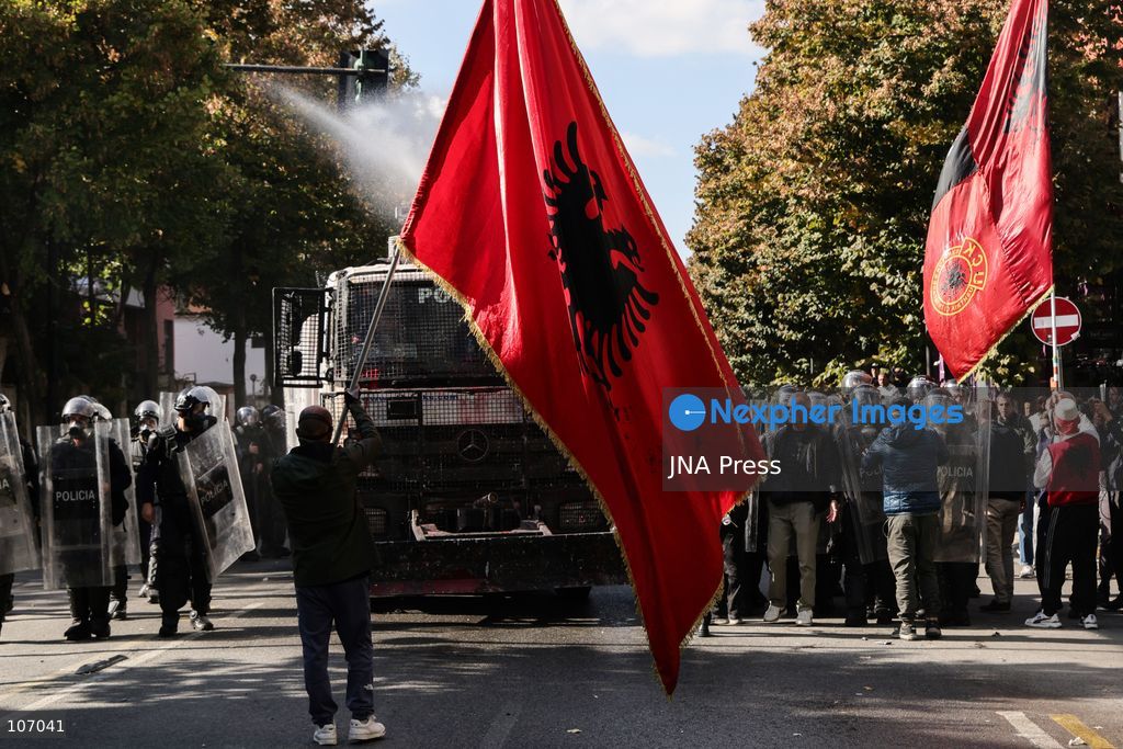 TIRANA, ALBANIA, OCTOBER 18, 2026: Demonstrators clash with riot police outside the Ministry of Education in Tirana as student-led anti-government protests continue for a sixth consecutive day. Protesters throw stones while police respond with tear gas, water cannons and rubber bullets. The demonstrations demand improved university conditions and the resignation of Prime Minister Edi Rama. (Photo by Vlasov Sulaj/JNA Press via Nexpher Images)