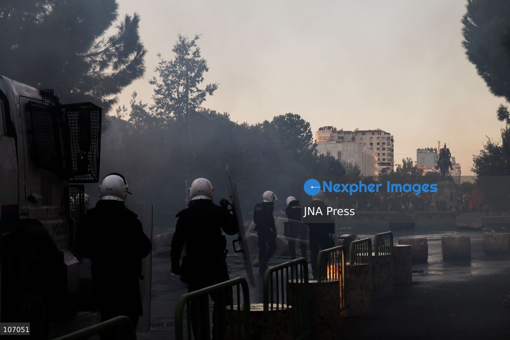 TIRANA, ALBANIA, OCTOBER 18, 2026: Demonstrators clash with riot police in Skanderbeg Square as student-led anti-government protests continue for a sixth consecutive day. Confrontations spread from the Ministry of Education to central Tirana, with protesters throwing stones and pyrotechnics while police deploy tear gas and water cannons. Demonstrators demand improved university conditions and the resignation of Prime Minister Edi Rama. (Photo by Vlasov Sulaj/JNA Press via Nexpher Images)