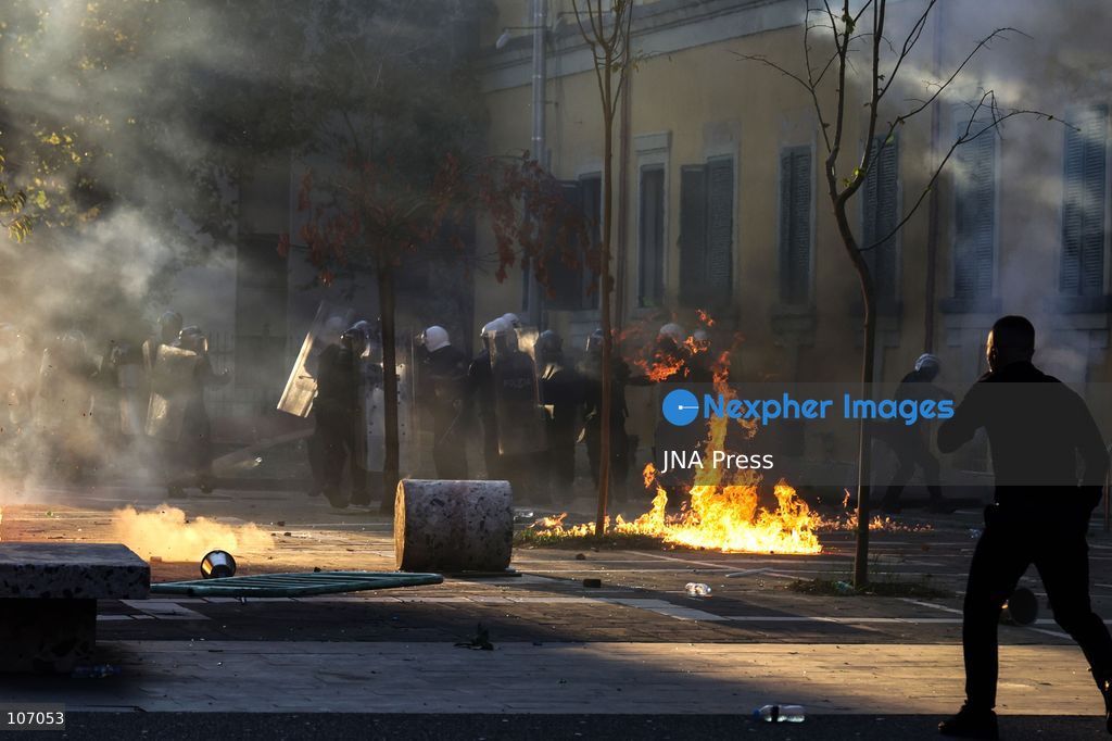 TIRANA, ALBANIA, OCTOBER 18, 2026: Demonstrators clash with riot police in Skanderbeg Square as student-led anti-government protests continue for a sixth consecutive day. Confrontations spread from the Ministry of Education to central Tirana, with protesters throwing stones and pyrotechnics while police deploy tear gas and water cannons. Demonstrators demand improved university conditions and the resignation of Prime Minister Edi Rama. (Photo by Vlasov Sulaj/JNA Press via Nexpher Images)