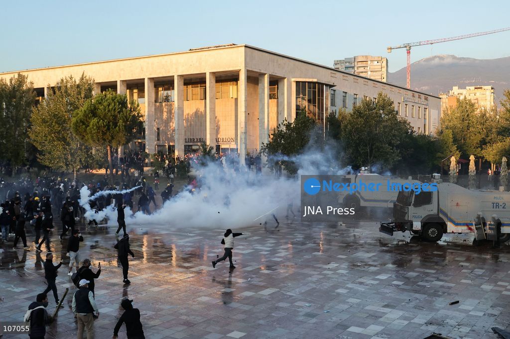 TIRANA, ALBANIA, OCTOBER 18, 2026: Demonstrators clash with riot police in Skanderbeg Square as student-led anti-government protests continue for a sixth consecutive day. Confrontations spread from the Ministry of Education to central Tirana, with protesters throwing stones and pyrotechnics while police deploy tear gas and water cannons. Demonstrators demand improved university conditions and the resignation of Prime Minister Edi Rama. (Photo by Vlasov Sulaj/JNA Press via Nexpher Images)